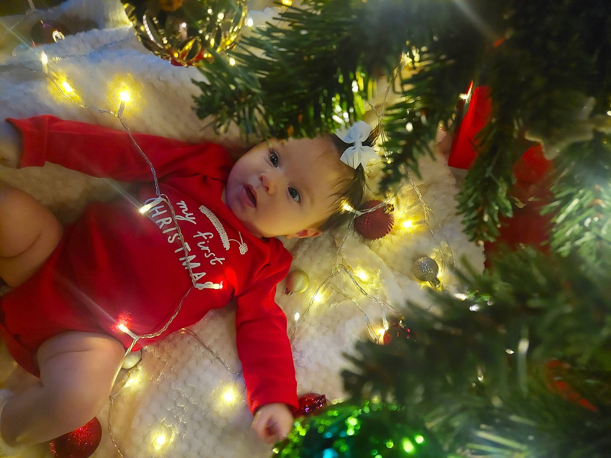 Penelope joined the competition — help win amazing prizes! child, christmas, christmas_decoration, christmas_eve, christmas_ornament, christmas_tree, conifer, event, evergreen, fun, happy, head, holiday, holiday_ornament, interior_design, light, ornament, person, smile, toddler