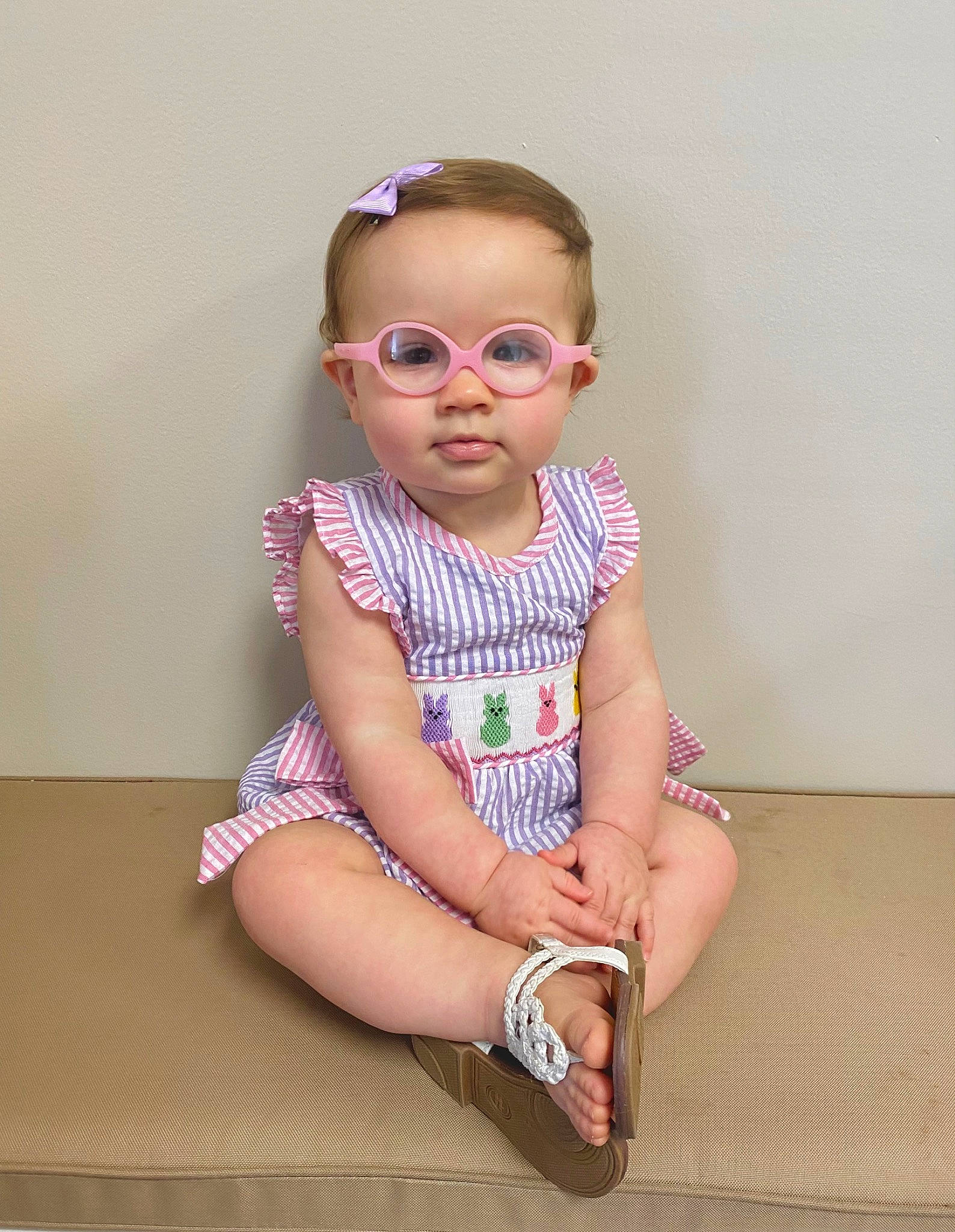 Everleigh is registered to the contest to win money with this photo: baby, baby_toddler_clothing, day_dress, dress, eyewear, face, glasses, goggles, hair, happy, lip, magenta, one_piece_garment, pattern, person, pink, sleeve, smile, sunglasses, toddler