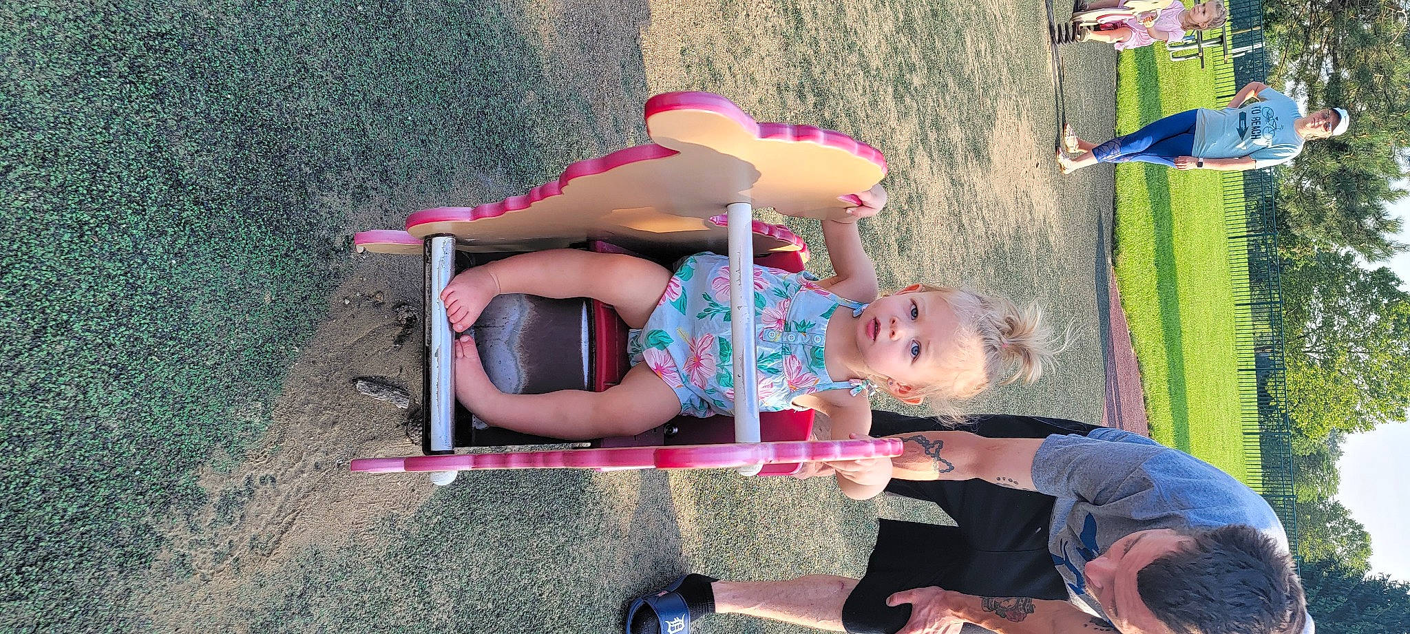 Milani is registered to the contest to win money with this photo: child, city, clothing, fun, happy, headwear, human_leg, leg, leisure, magenta, people_in_nature, person, pink, public_space, recreation, sandal, shorts, sitting, smile, summer