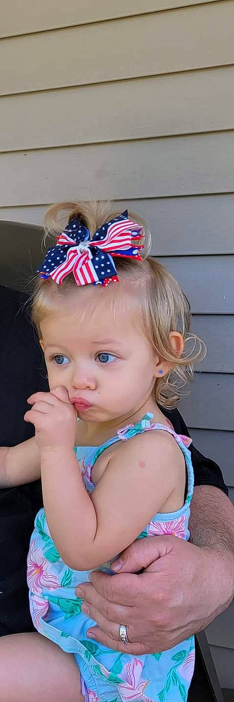 Milani is registered to the contest to win money with this photo: baby_toddler_clothing, cap, child, chin, clothing, cool, costume_hat, eye, hair, hand, head, headgear, headpiece, helmet, iris, jewellery, neck, party_hat, person, pink