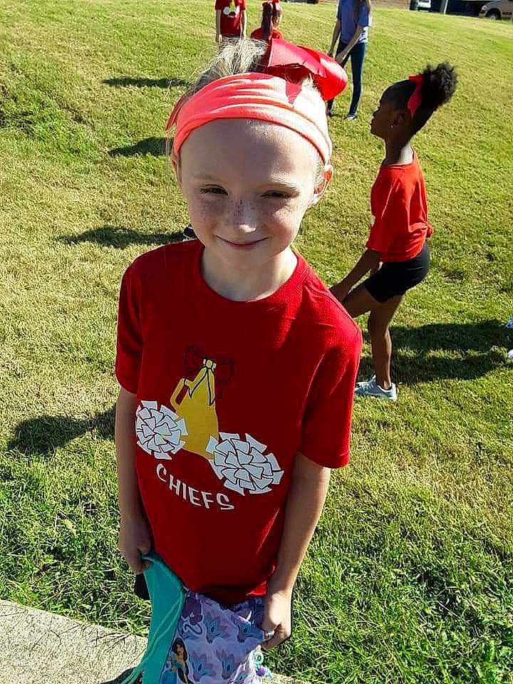 Rilee is registered to the contest to win money with this photo: baby_toddler_clothing, baseball_cap, cap, child, cool, costume_hat, fashion_accessory, fun, grass, happy, headgear, headwear, joy, leisure, person, play, recreation, red, shorts, sleeve