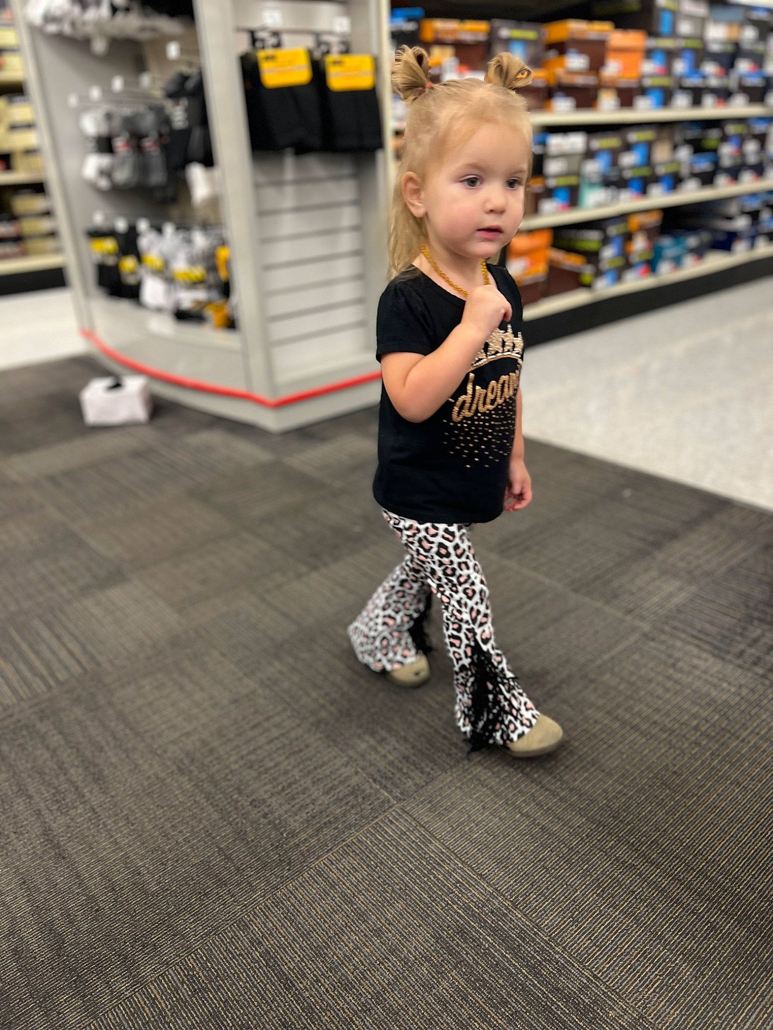 Piper is registered to the contest to win money with this photo: baby, baby_toddler_clothing, child, face, fashion_design, floor, flooring, fun, happy, human_leg, joint, leg, leisure, person, recreation, retail, shoulder, sleeve, sportswear, t_shirt
