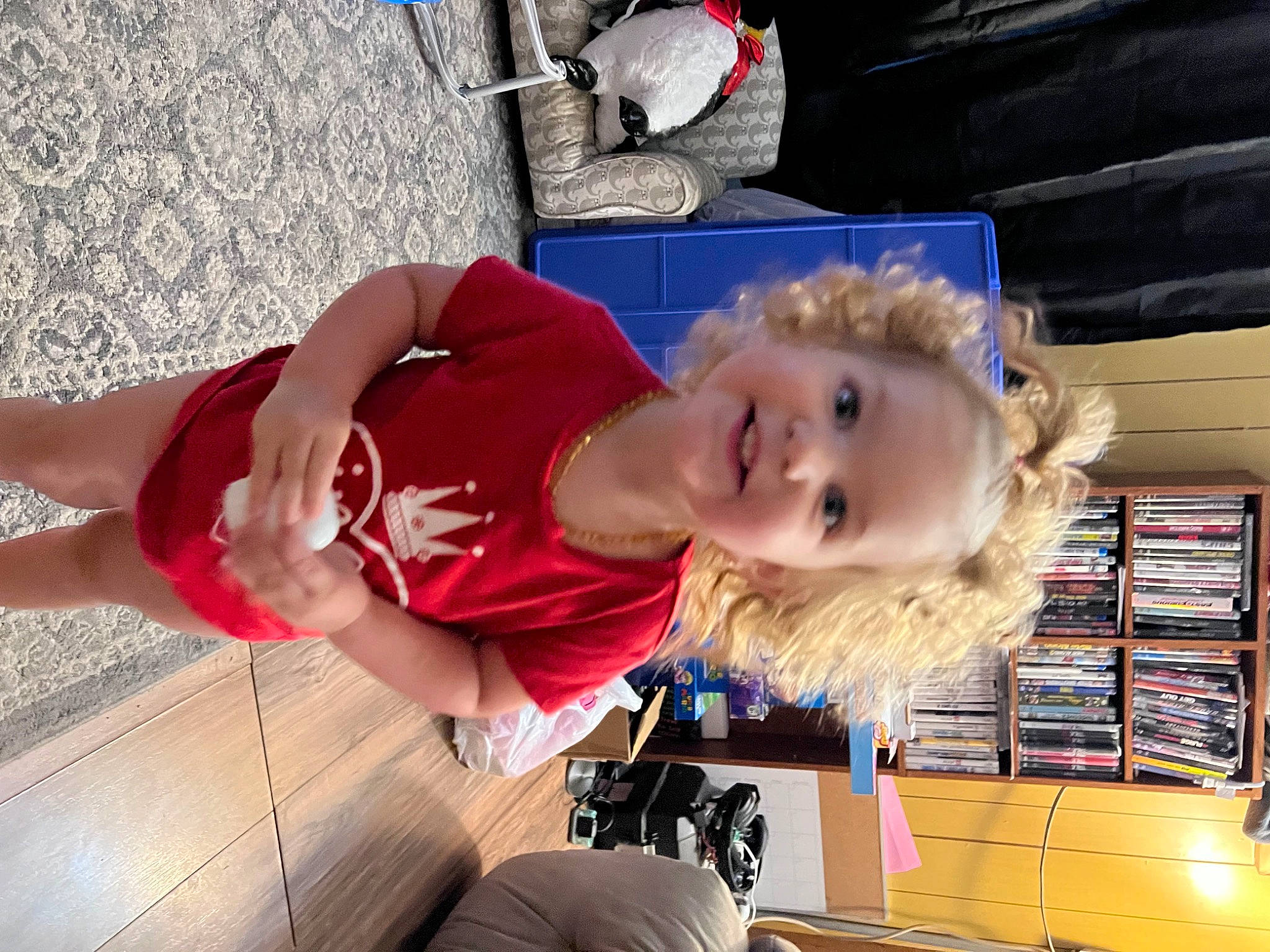 Piper joined the competition — help win amazing prizes! bookcase, child, elbow, fun, human_leg, joy, knee, person, publication, shelf, shelving, smile, thigh, toddler