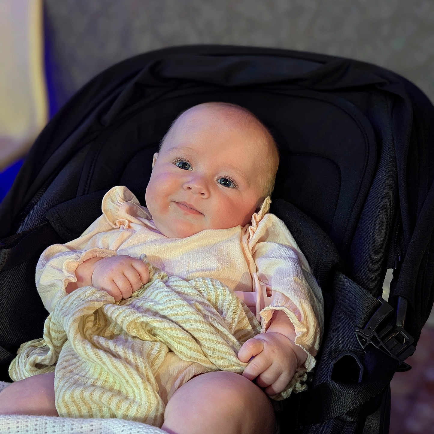 Dolcey joined the competition — help win amazing prizes! baby, blanket, child, clothing, comfort, cute, face, hand, indoors, infant, leg, pastel_colors, person, portrait, seat, skin, smile, soft_lighting, stroller, young_child