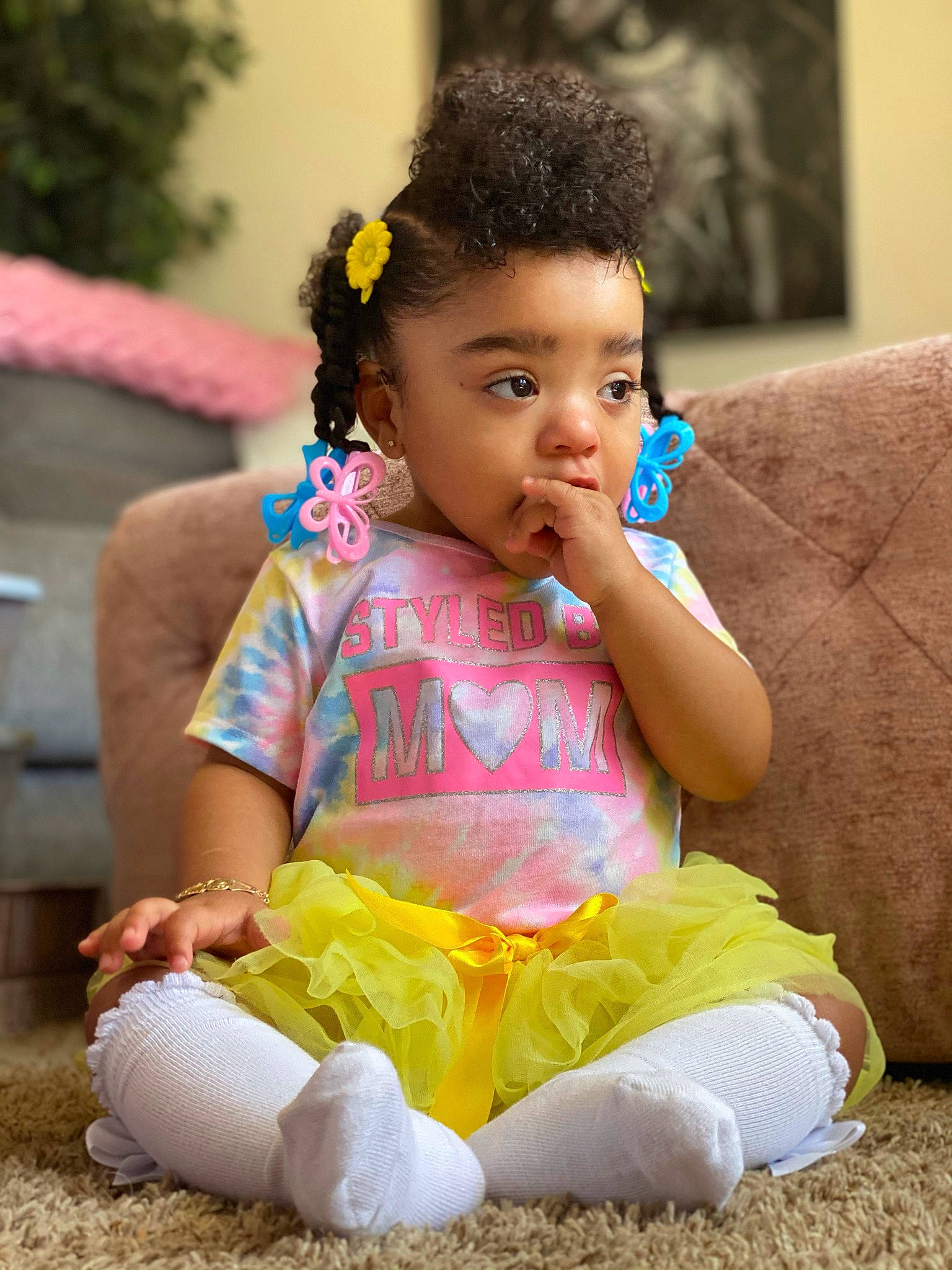 Esperanza is registered to the contest to win money with this photo: baby, baby_toddler_clothing, child, event, facial_expression, finger, fun, grass, hairstyle, happy, headpiece, jewellery, leisure, person, picture_frame, play, sitting, skin, smile, toddler