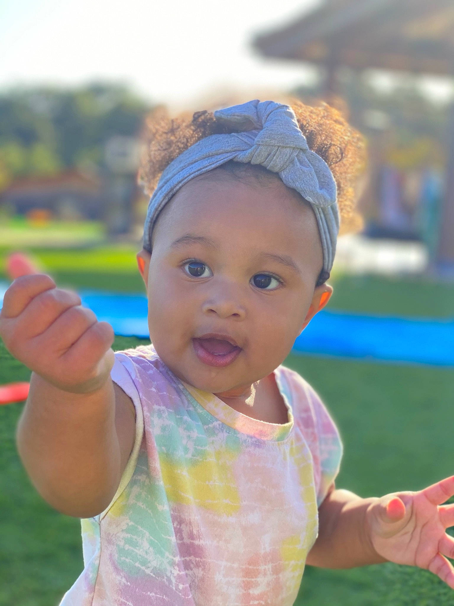 Amani joined the competition — help win amazing prizes! baby, child, eyewear, fashion_accessory, fun, gesture, grass, happy, headband, headpiece, jewellery, leaf, leisure, lip, people_in_nature, person, pink, play, recreation, toddler