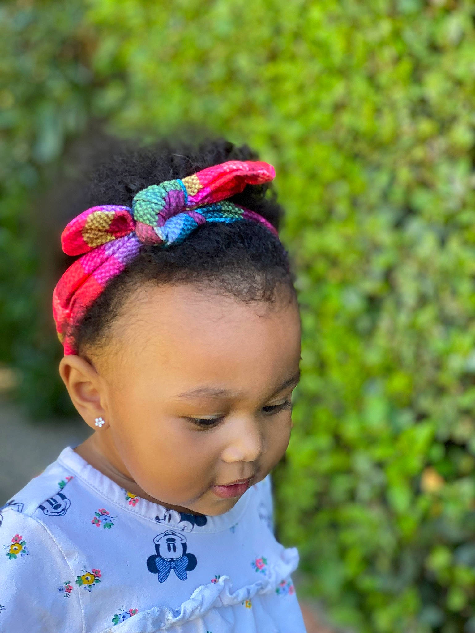 Amani joined the competition — help win amazing prizes! black_hair, eye, fashion_accessory, forehead, grass, hair, hair_accessory, happy, head, headband, headgear, headpiece, jewellery, magenta, neck, people_in_nature, person, plant, sunglasses, toddler