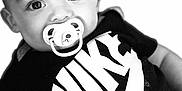 Lystiano a rejoint le concours — aidez-le/la à gagner de superbes lots ! baby, black_and_white, child, closeup, clothing, cute, expression, eyes, face, head, infant, logo, monochrome, nike, pacifier, person, portrait, studio, tshirt, young