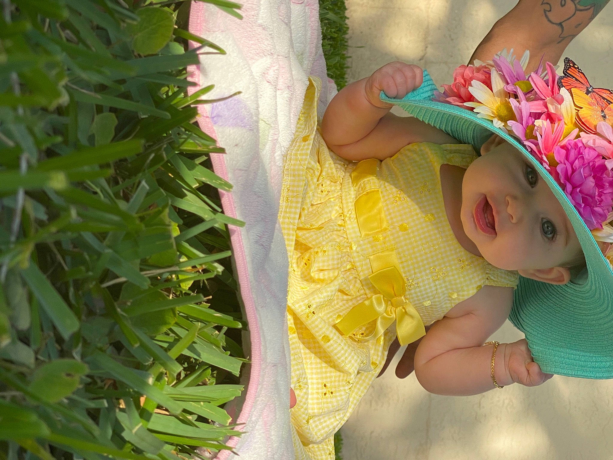 Ciana is registered to the contest to win money with this photo: baby, baby_products, baby_toddler_clothing, child, fashion_accessory, flower, grass, happy, hat, headpiece, headwear, leaf, pattern, people_in_nature, person, petal, plant, skin, sun_hat, terrestrial_plant