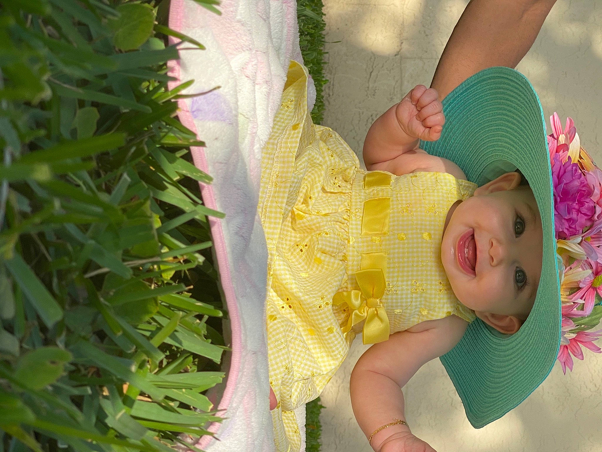 Ciana is registered to the contest to win money with this photo: baby, baby_products, baby_toddler_clothing, botany, child, dress, fashion_accessory, fun, grass, green, happy, headwear, human_body, pattern, people_in_nature, person, plant, terrestrial_plant, textile, toddler