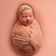 Scarlett joined the competition — help win amazing prizes! newborn, baby, sleeping, wrapped, blanket, headband, flower, soft_texture, peach, portrait, infant, cute, peaceful, studio, cozy, closeup, child, toddler, resting, warm