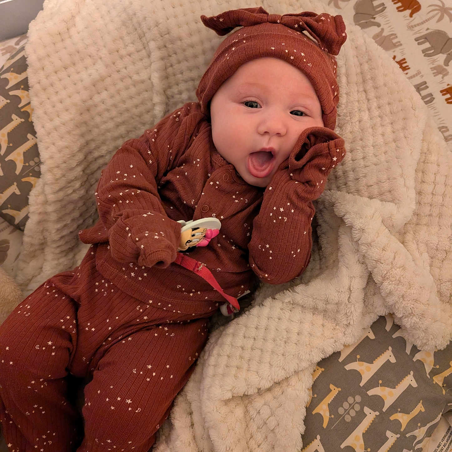 Hartlyn is registered to the contest to win money with this photo: baby, babylaughing, blanket, bodypart, bonnet, clothing, couch, face, furniture, happy, hat, head, hood, knitwear, newborn, person, photography, portrait, quilt, sweater