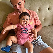 Draven joined the competition — help win amazing prizes! affection, baby, casual, child, clothing, couch, family, furniture, hairstyle, happy, indoor, onesie, person, portrait, seated, shorts, skin, smiling, socks, young_man