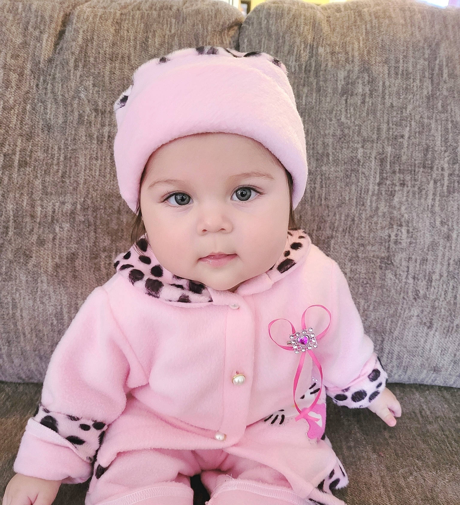 Nalani joined the competition — help win amazing prizes! baby, baby_toddler_clothing, cap, cheek, child, chin, eye, eyelash, face, fashion_accessory, grass, happy, headwear, jacket, knit_cap, lip, magenta, outerwear, person, pink