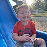 Colton joined the competition — help win amazing prizes! child, toddler, smile, happy, water_bottle, slide, playground, outdoor, sunlight, lens_flare, tree, grass, shorts, red_shirt, casual_clothing, play, fun, park, daytime, person