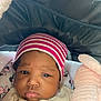 Sevyn joined the competition — help win amazing prizes! baby, infant, child, hat, striped_hat, pink, plush, blanket, cushion, mickey_mouse, minnie_mouse, face, portrait, clothing, cozy, indoors, cute, expression, warm, person