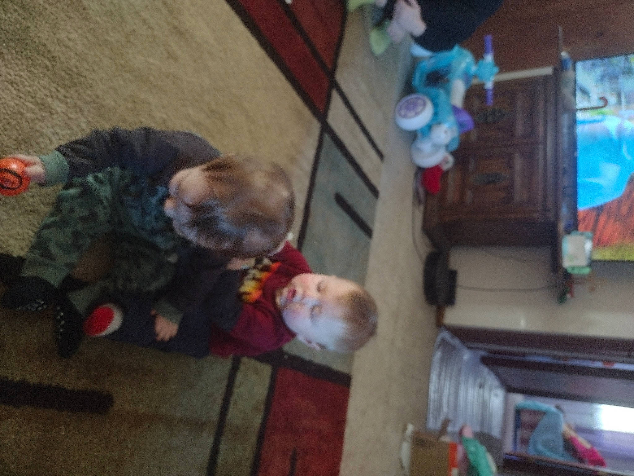 Nicholas is registered to the contest to win money with this photo: baby, child, event, flooring, fun, leisure, person, room, sitting, toddler, tree, wood