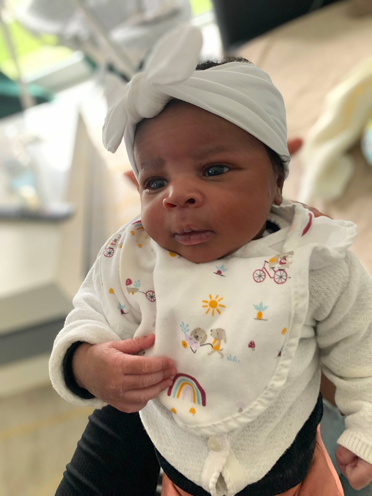 Assiya participe au concours pour gagner de l'argent avec cette photo : baby, baby_products, baby_toddler_clothing, bib, cap, cheek, child, chin, fun, gesture, happy, headwear, lip, person, portrait_photography, sitting, skin, sleeve, t_shirt, toddler