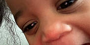 Aspen is registered to the contest to win money with this photo: child, close_up, smiling, happy, teeth, face, joy, person, emotion, expression, black_hair, indoor, skin, eye, mouth, cheek, casual_clothing, fun, young, portrait