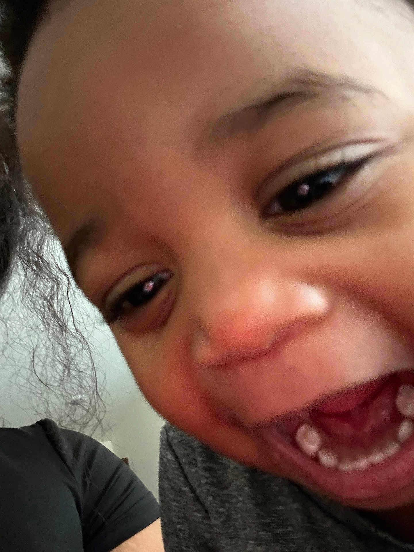 Aspen is registered to the contest to win money with this photo: child, close_up, smiling, happy, teeth, face, joy, person, emotion, expression, black_hair, indoor, skin, eye, mouth, cheek, casual_clothing, fun, young, portrait