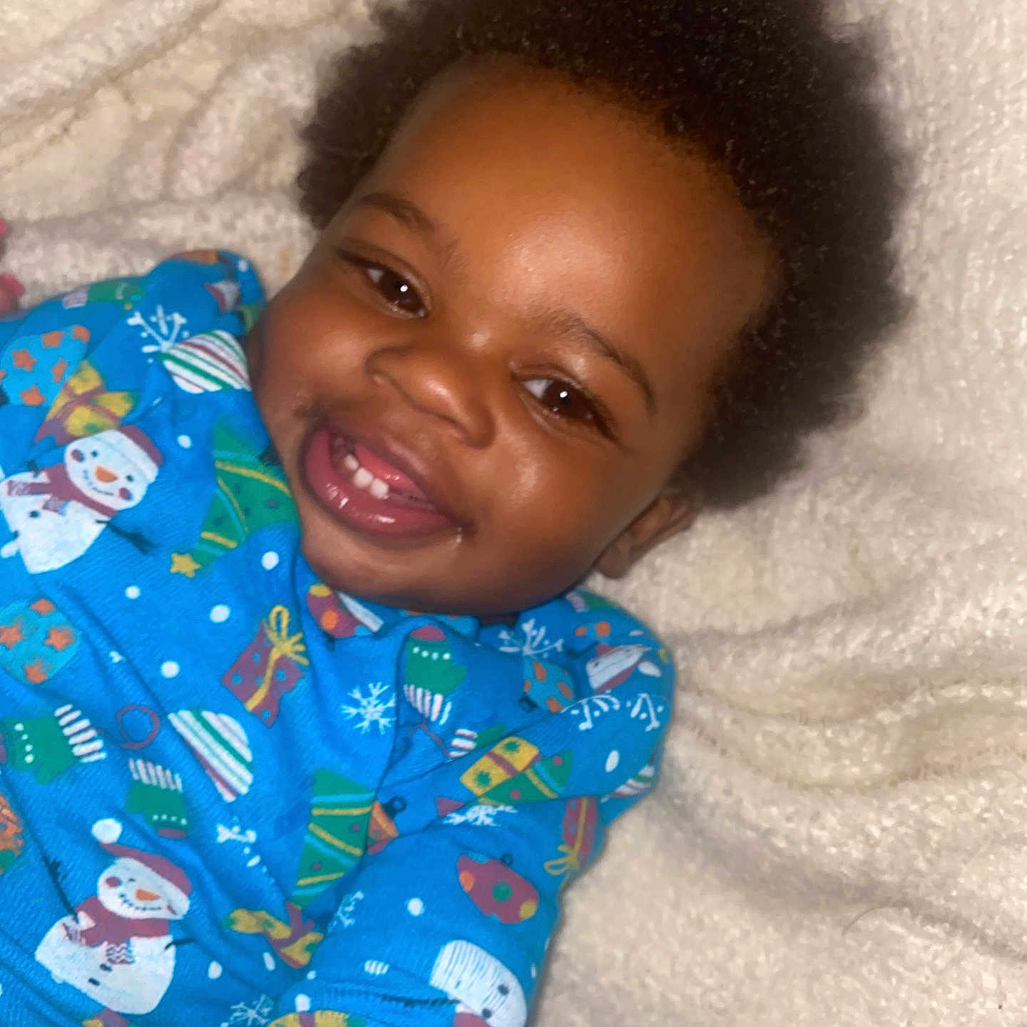 Prophet Elijah Smith is registered to the contest to win money with this photo: baby, babylaughing, bed, blanket, bodypart, clothing, face, furniture, happy, head, laughing, mouth, pajamas, person, photography, portrait, quilt, selfie, smile, teeth