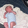 baby, blanket, cozy, curious, fabric, face, head, human, indoor, infant, lying_down, newborn, onesie, resting, skin, sleepwear, small_feet, small_hands, soft_texture, striped_blanket