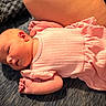 baby, infant, pink_clothing, lying_down, blanket, newborn, soft_texture, peaceful, indoors, child, small_hands, cute, sleepy, person, portrait, resting, closeup, skin, head, cozy