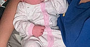 Evelyn is registered to the contest to win money with this photo: adult, arms, baby, bed, blanket, child, closeup, cuddling, family, indoor, infant, newborn, pajamas, peaceful, photography, pink, portrait, resting, sleeping, white