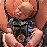 Evelyn joined the competition — help win amazing prizes! baby, infant, sleeping, car_seat, harness, pink, blue_clothing, portrait, indoors, sitting, safe, newborn, bare_feet, toes, closed_eyes, head, child, vehicle, cushion, photography