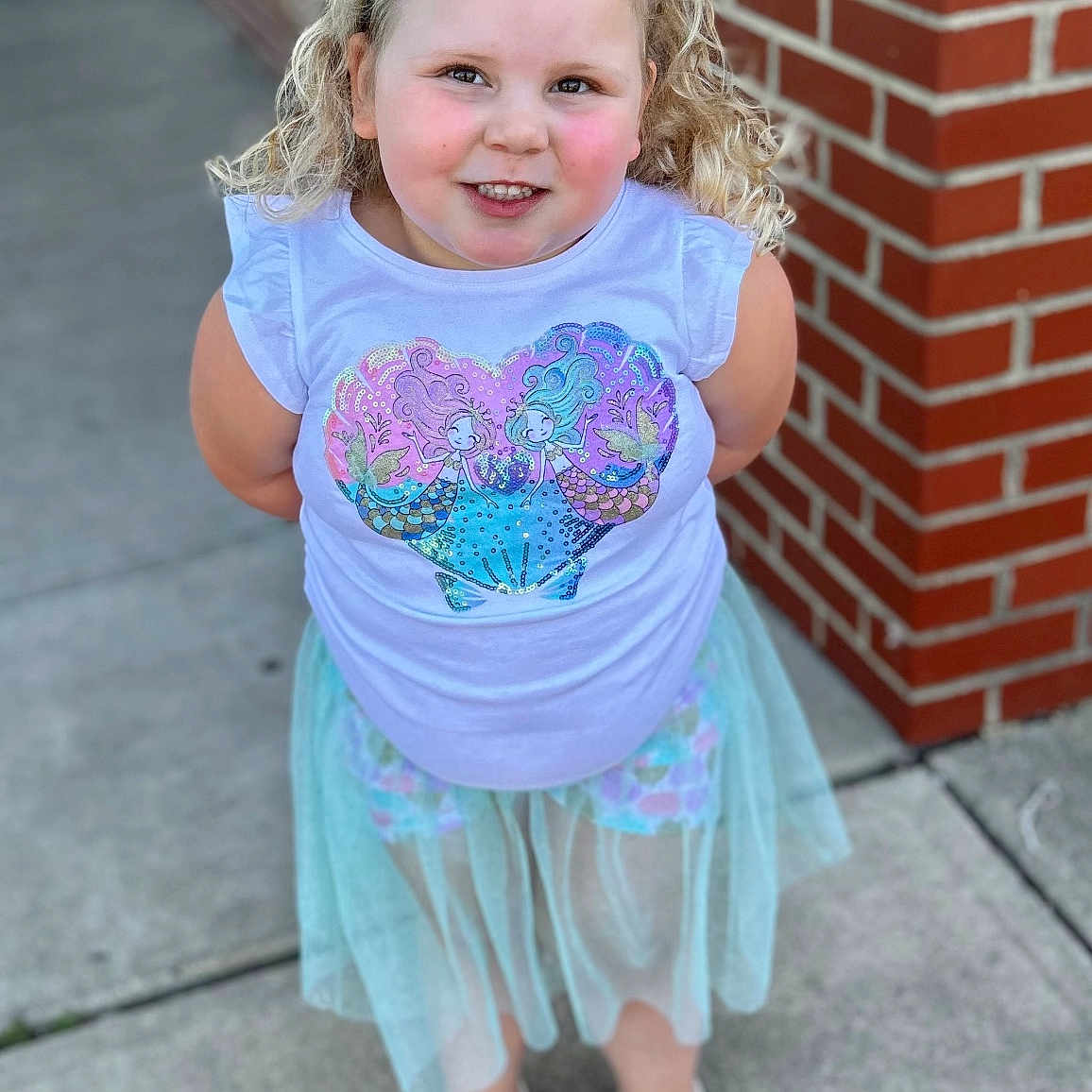 River joined the competition — help win amazing prizes! brick, child, city, clothing, dress, face, female, footwear, girl, head, pants, person, photography, portrait, road, sandal, shoe, skirt, street, urban