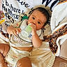 Ayla is registered to the contest to win money with this photo: baby, blanket, bottle, child, clothing, comfort, cute, diaper, expression, face, feeding, foot, hand, homedecor, indoors, infant, lying_down, soft, toddler, toy