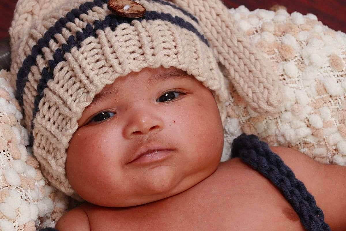 Noel is registered to the contest to win money with this photo: baby, baby_sleeping, cap, cheek, child, comfort, eye, eyelash, face, happy, head, headgear, headwear, iris, knit_cap, lip, nose, person, skin, smile