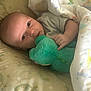Jerry joined the competition — help win amazing prizes! baby, infant, plush_toy, blanket, bed, bedding, soft_toy, person, child, sleeping_area, cute, indoors, comfort, resting, holding, patterned, colorful, toddler, lying_down, cozy
