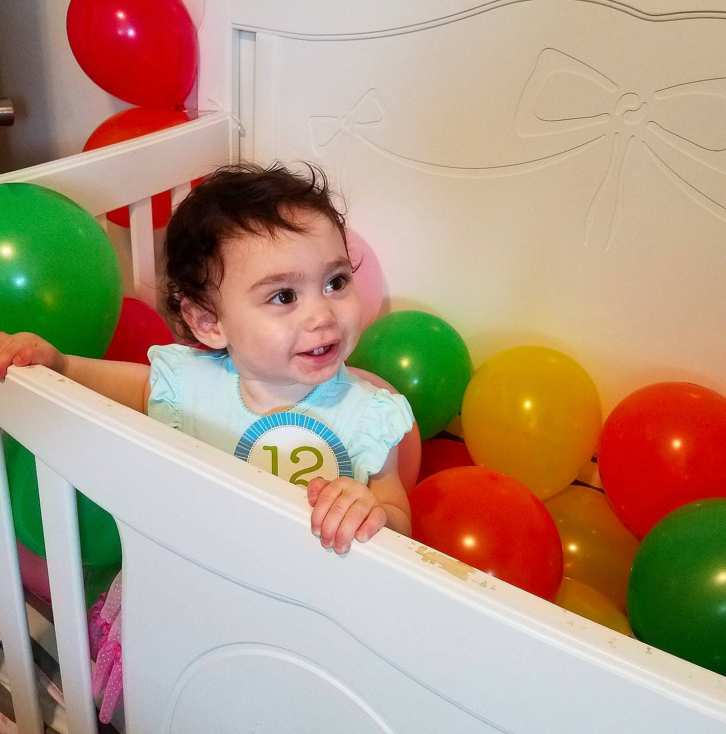 Emilia is registered to the contest to win money with this photo: balloon, child, fun, infant, party_supply, person, play, product, smile, toddler, toy