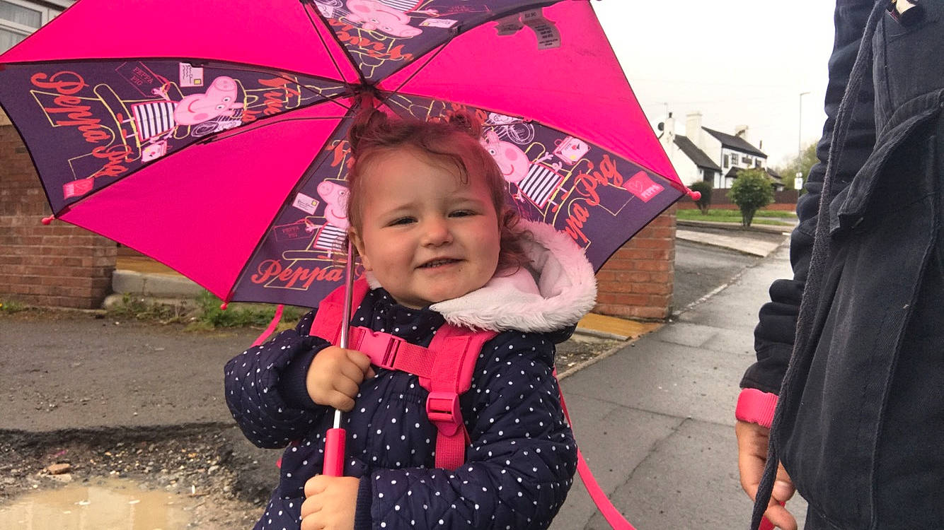 Skyla-rose is registered to the contest to win money with this photo: child, fashion_accessory, fun, joy, magenta, outerwear, person, pink, rain, smile, toddler, umbrella