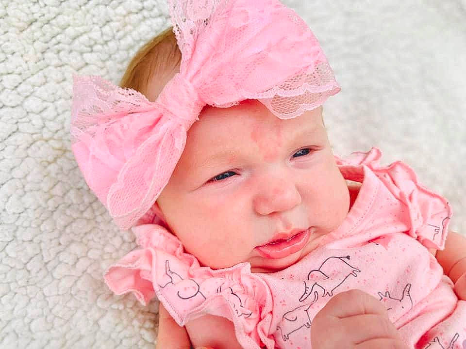Emberley Ray joined the competition — help win amazing prizes! baby, baby_toddler_clothing, cheek, child, chin, close_up, eyelash, face, facial_expression, happy, headgear, headwear, human, lip, nose, pattern, person, pink, skin, sleeve