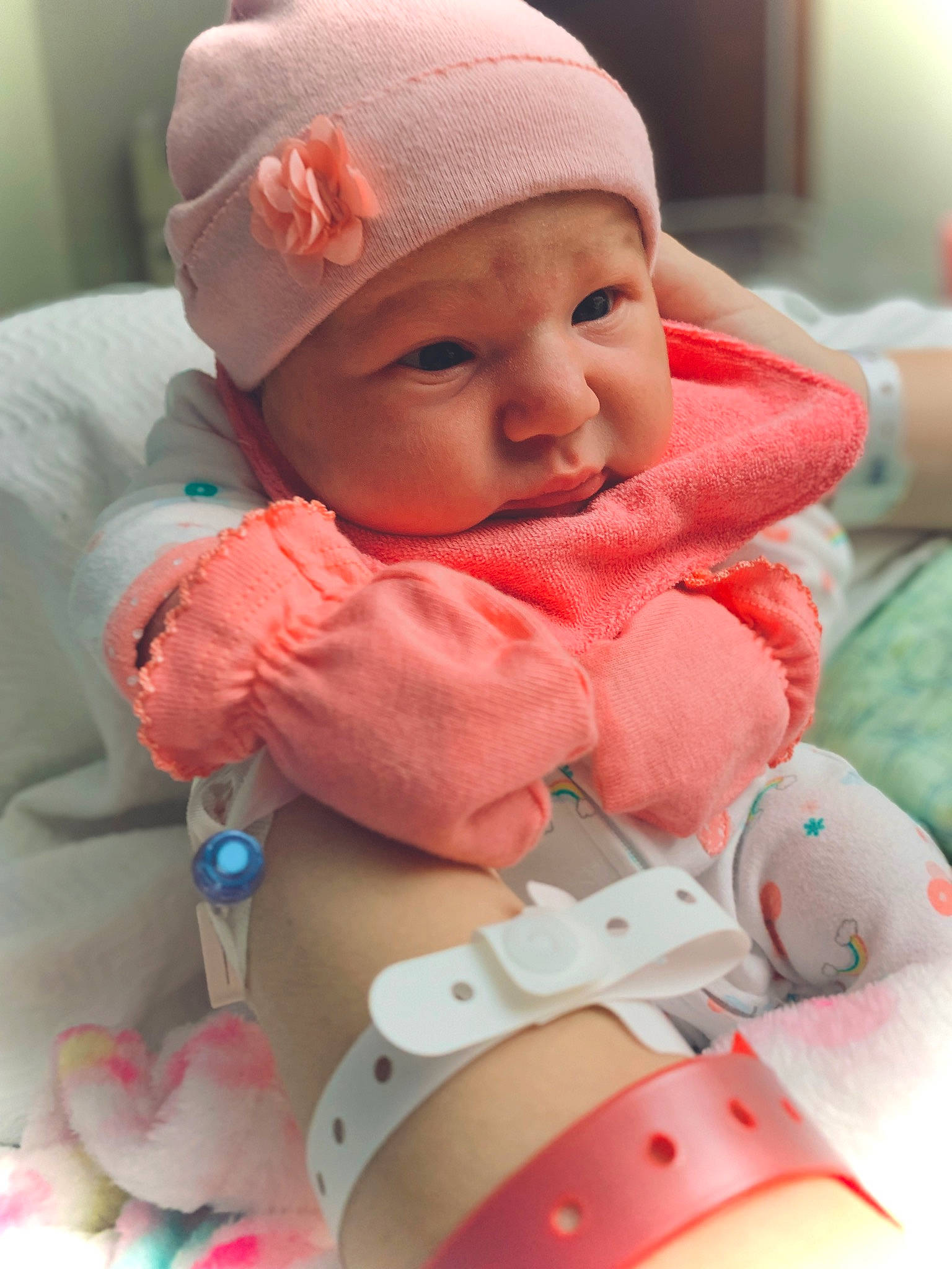 Emberley Ray is registered to the contest to win money with this photo: baby, baby_toddler_clothing, cap, cheek, child, comfort, headgear, headwear, lip, mouth, pattern, person, personal_protective_equipment, pink, product, red, skin, sleeve, smile, textile