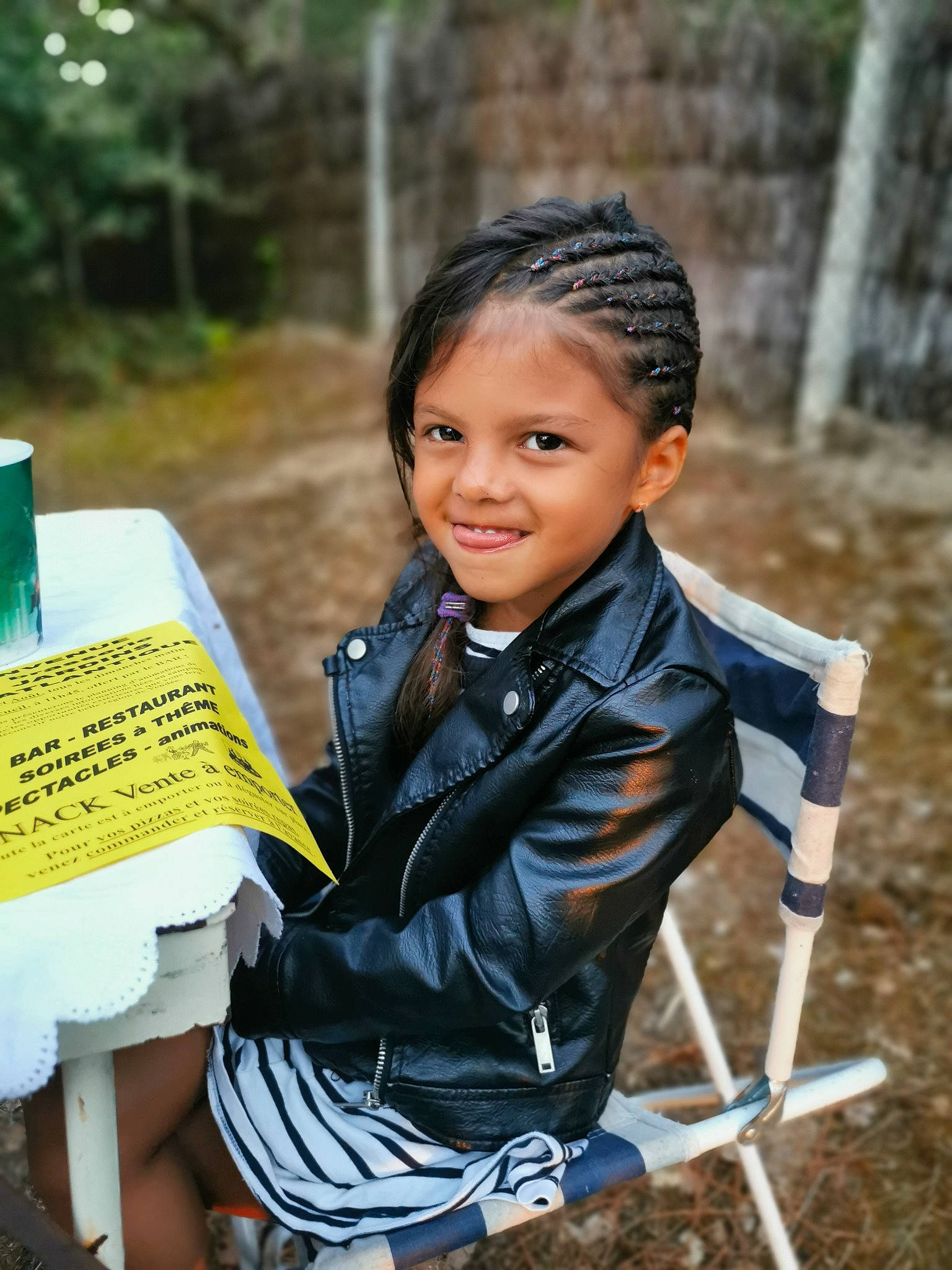 Ashley participe au concours pour gagner de l'argent avec cette photo : child, dress, formal_wear, fun, grass, hairstyle, happy, joy, leisure, natural_environment, people_in_nature, person, portrait_photography, reading, recreation, sitting, smile, soil, suit, toddler