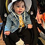 toddler, child, hat, denim_jacket, car_seat, white_shoes, black_pants, indoor, cute, smiling, baby, footwear, clothing, seat, person, young_child, headwear, casual_wear, comfortable, curious
