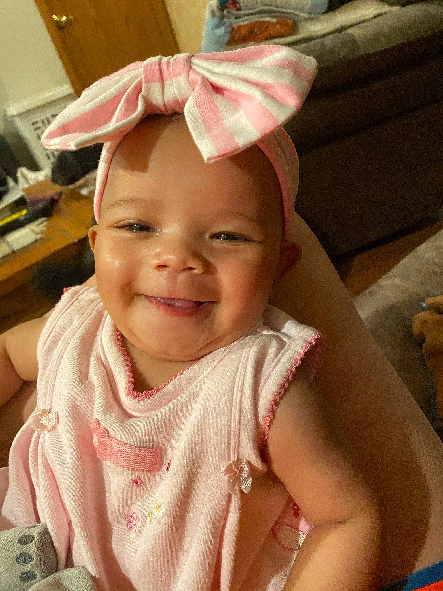 Winry is registered to the contest to win money with this photo: baby, bonnet, cheek, child, ear, eye, face, facial_expression, happy, hat, head, headgear, headwear, joy, lip, people, person, pink, skin, smile