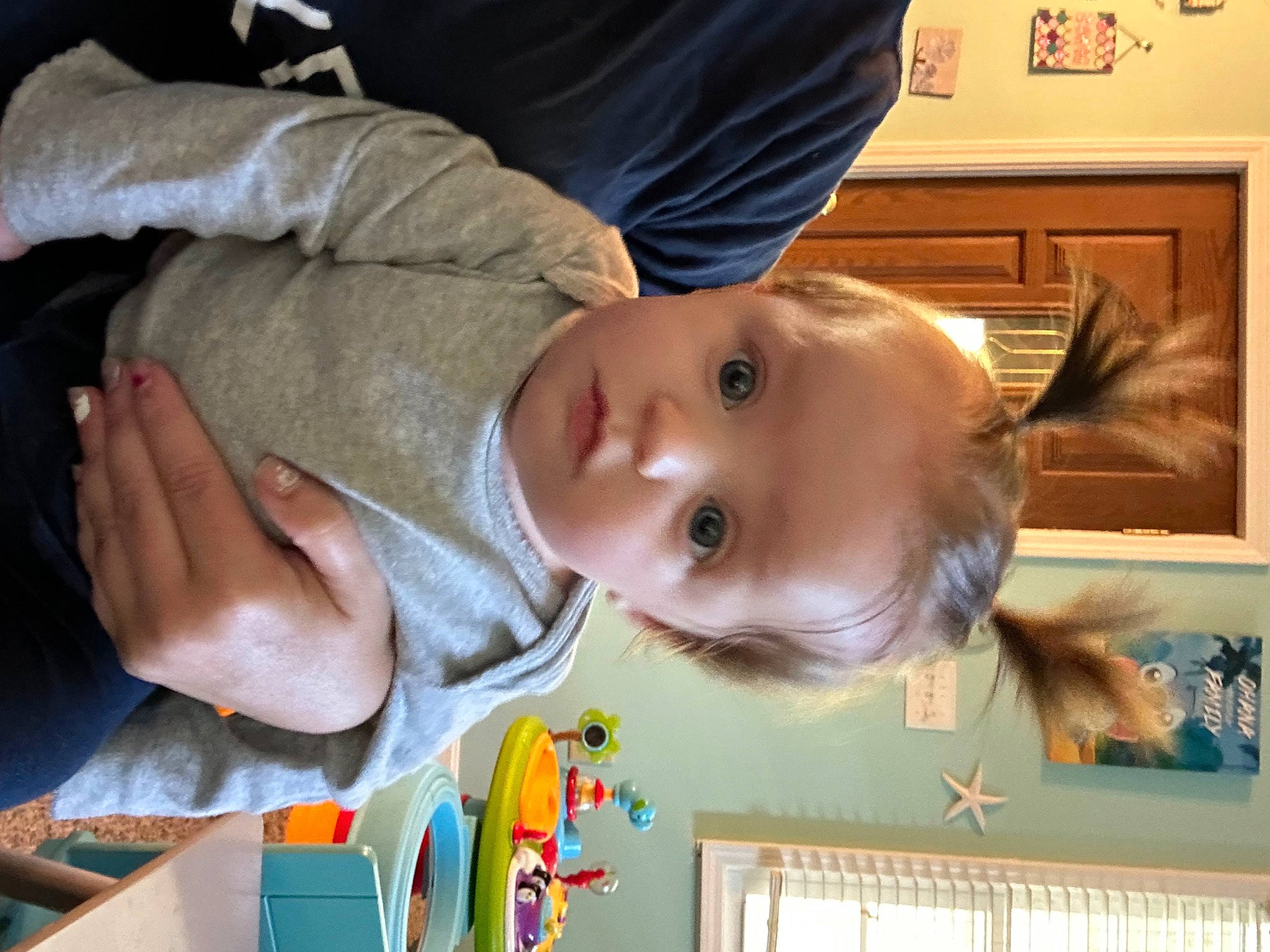 Paisley is registered to the contest to win money with this photo: baby, baby_products, baby_toddler_clothing, cheek, child, fun, happy, iris, nose, person, picture_frame, room, smile, toddler, tree, wood