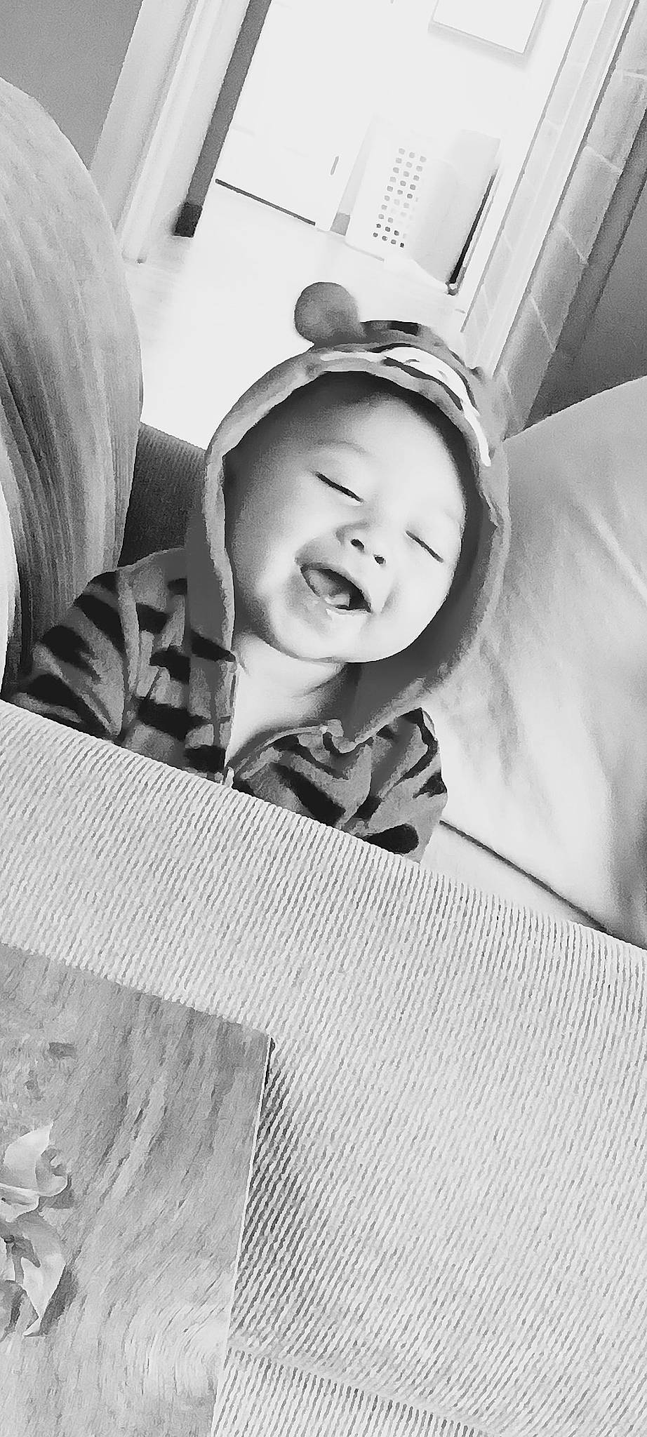 Adonis is registered to the contest to win money with this photo: automotive_design, baby, black_and_white, child, comfort, eyebrow, flash_photography, fun, gesture, happy, human, monochrome, monochrome_photography, pattern, person, sitting, smile, style, tints_and_shades, toddler