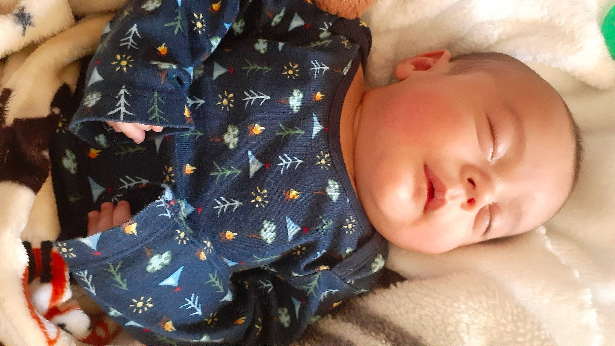 Elias joined the competition — help win amazing prizes! baby, baby_sleeping, baby_toddler_clothing, cheek, child, comfort, finger, gesture, hand, iris, linens, lip, mouth, nose, pattern, person, skin, sleeve, textile, thigh