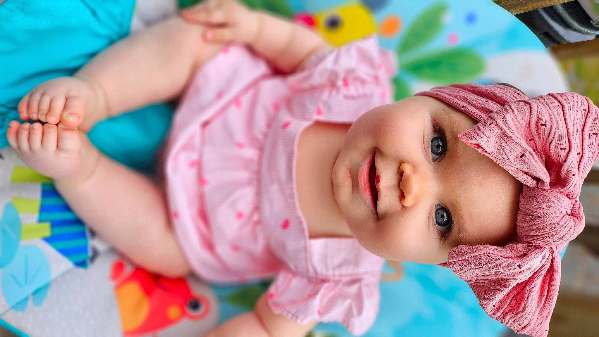 Scarlett is registered to the contest to win money with this photo: baby, baby_toddler_clothing, cheek, child, dress, eyelash, fashion_accessory, fun, grass, hand, happy, hat, headwear, joy, lip, nose, pattern, person, pink, product