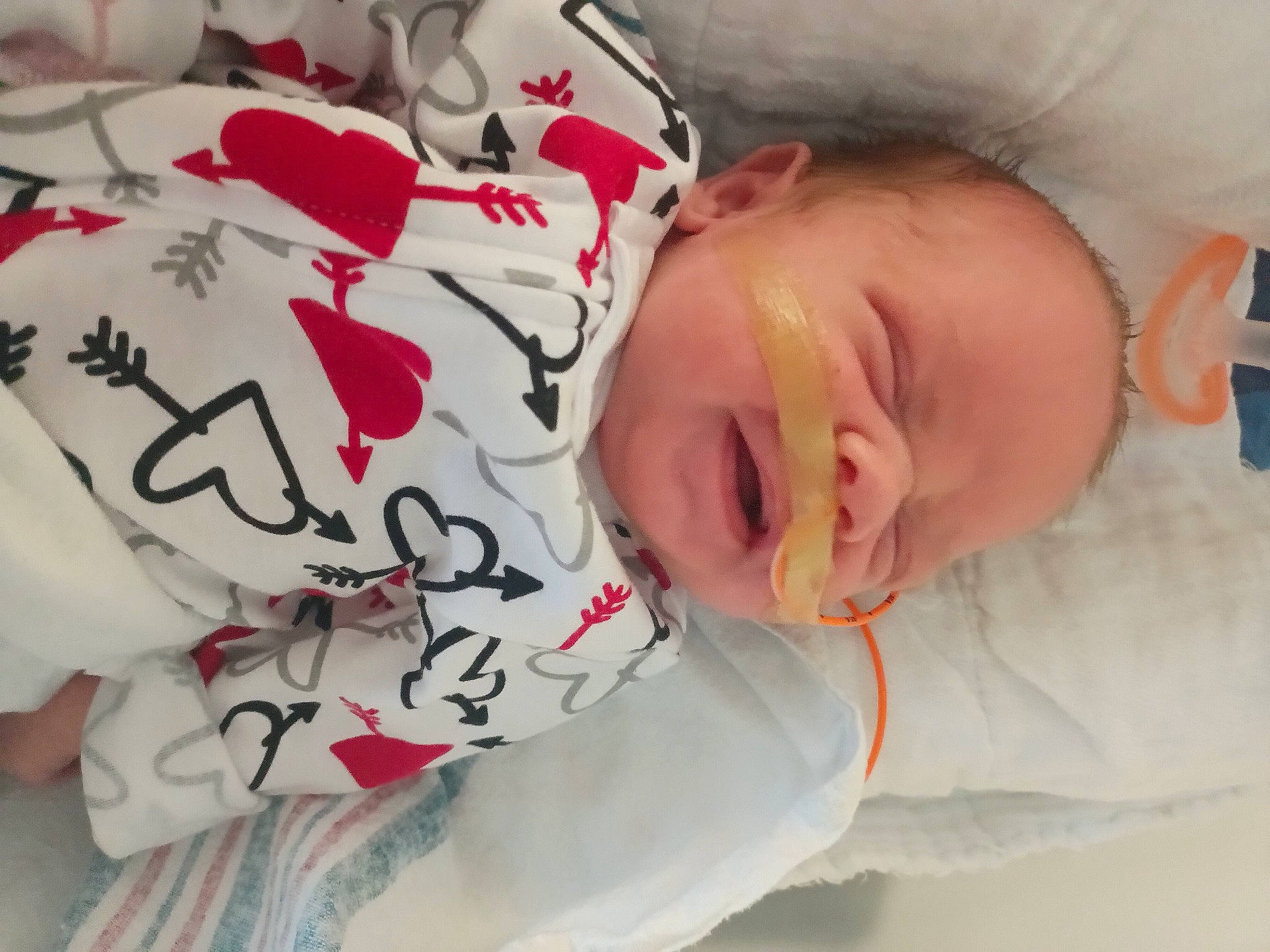 Noah is registered to the contest to win money with this photo: baby, baby_toddler_clothing, carmine, cheek, child, comfort, font, happy, linens, pattern, person, pink, product, skin, sleeve, smile, textile, toddler