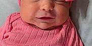 Kayelani is registered to the contest to win money with this photo: baby, infant, pink, headband, bow, sleeping, clothing, cute, portrait, face, newborn, child, soft, resting, indoors, person, closeup, apparel, fabric, peaceful