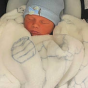 Adam is registered to the contest to win money with this photo: newborn, baby, sleeping, blanket, blue_hat, infant, cozy, soft_texture, face, closed_eyes, cushion, car_seat, cute, peaceful, indoor, child, portrait, warm, resting, baby_clothing