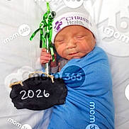 Kaleb is registered to the contest to win money with this photo: newborn, baby, sleeping, blue_blanket, hospital_hat, chalkboard, sign, date, bed, white_bedding, hand, peaceful, wrapped, infant, portrait, watermark, mom_365, closeup, cute, indoors
