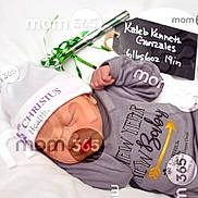 Kaleb joined the competition — help win amazing prizes! baby, baby_clothes, blanket, chalkboard, child, cute, gray_clothing, hat, hospital, infant, lying_down, mom365_watermark, name_sign, new_year, newborn, pacifier, peaceful, portrait, resting, sleeping