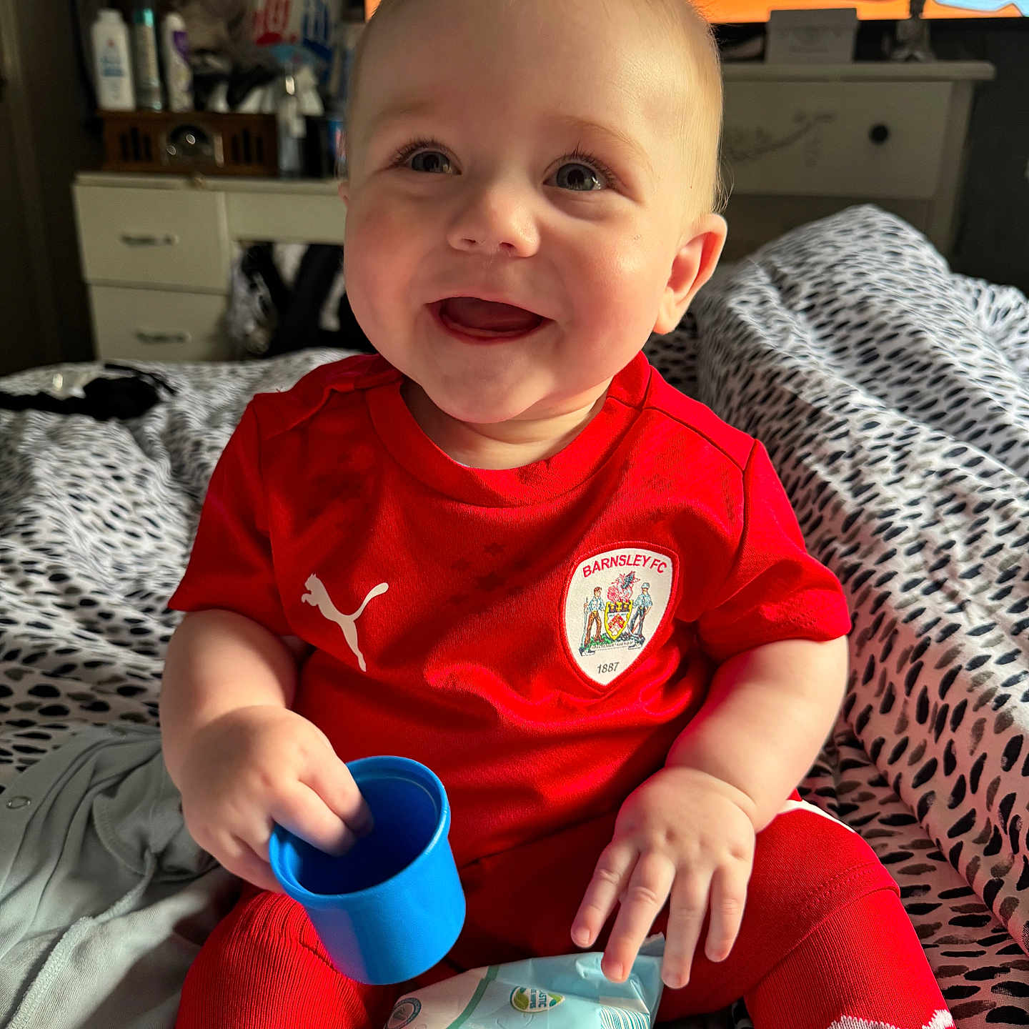 Archer-Blaine joined the competition — help win amazing prizes! baby, bed, bedroom, beverage, bodypart, clothing, coffee, couch, cup, face, finger, furniture, hand, head, indoors, person, photography, portrait, room, t_shirt